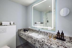 Koupelna v ubytování Dorint Hotel Esplanade Jena + 35 fotografií