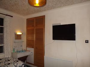 TV a/nebo společenská místnost v ubytování Glenavon Homestay + 10 fotografií