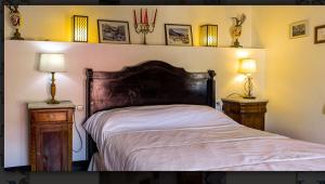 a bedroom with a large bed with two night stands at Casa Valor in Penáguila