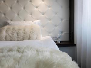 Voodi või voodid majutusasutuse Hotel Riverton toas