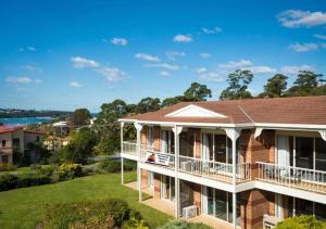 an aerial view of a house with a balcony at Merimbula Sapphire Motel in Merimbula
