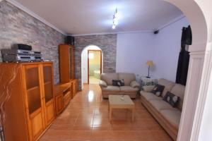 a living room with a couch and a table at Book Jet - Villa Vacacional libertad Pajara 