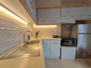 Kuchyň nebo kuchyňský kout v ubytování ParkView Central Apartment - Xanthi