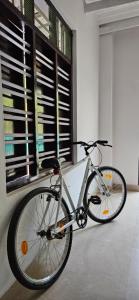 a bike parked in a room with a window at LemonTree Homestay & Camping in Kollam
