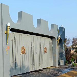 a metal gate with two crabs on it at Curtis House in Hyderabad