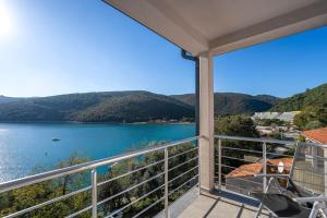 a balcony with a view of a body of water at Astrid 2 in Rabac