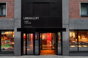 an entrance to a store with glass doors at URBAN LOFT Cologne in Cologne