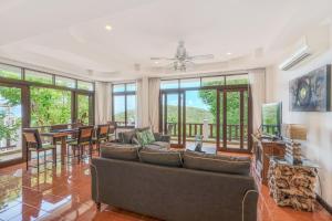 a living room with a couch and a table at 3 Bedroom Villa Cara SDV042-By Samui Dream Villas in Mae Nam