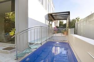 a swimming pool on the balcony of a house at The Grange 11 in Cape Town