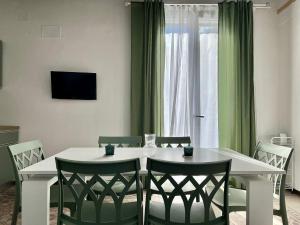 Телевизор и/или развлекательный центр в M'AMA apartment
