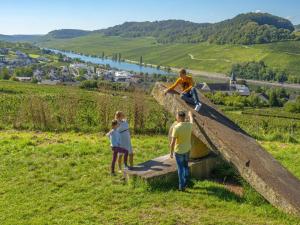 a group of people standing on a ramp with a skateboard at Appartements im Weingut Frieden-Berg in Nittel