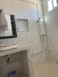 a bathroom with a sink and a mirror at Dar Ayour Todra Gorges in Aït Baha