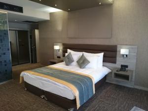 Postel nebo postele na pokoji v ubytování Livello Hotel