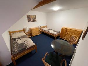 Posteľ alebo postele v izbe v ubytovaní Apartmány u Michala