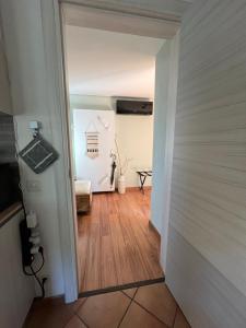 a hallway with a door leading into a room at The Comfy Apartment in Ponte Capriasca