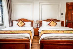 Letto o letti in una camera di Phu My Hai Hotel