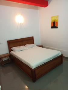 Postel nebo postele na pokoji v ubytování HOTEL BADINCA Alojamento Low Cost in Bissau avenida FRANCISCO MENDES