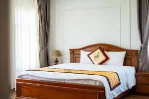 Letto o letti in una camera di Phu My Hai Hotel
