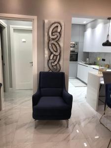 a living room with a snake on the wall at B & K Luxury & Elegant Volos Suite in Volos