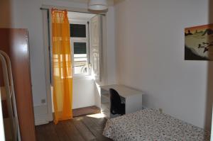 Cama ou camas em um quarto em Covilhã Hostel