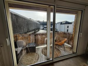 a view from a window of a balcony at Appartement 2 Chambres INDIaNA Hyper centre in Vitré