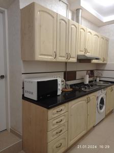 Kuchyň nebo kuchyňský kout v ubytování RynOK 25 Modern Lviv Center