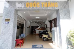 a garage with a motorcycle parked inside of it at Quốc Thắng Hotel in Vung Tau