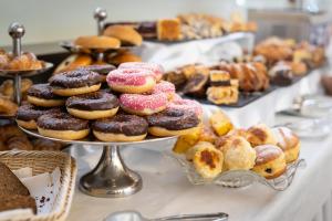 a display of different types of donuts on a table at Hotel Tatra in Bratislava