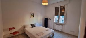 A bed or beds in a room at Bolognina Apartments