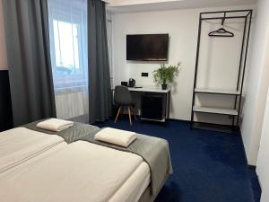 Posteľ alebo postele v izbe v ubytovaní Garbarska 22 Aparthotel