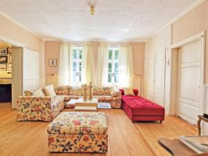 a living room with a couch and a table at MB-Farmhouse in Süderhastedt