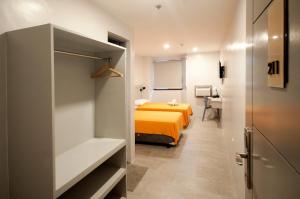 Postel nebo postele na pokoji v ubytování Hotel Lucca
