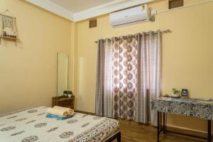 Postel nebo postele na pokoji v ubytování Mulaqat Homestay