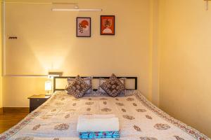 Postel nebo postele na pokoji v ubytování Mulaqat Homestay
