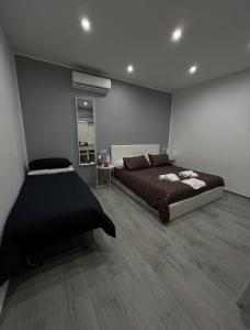 a bedroom with a bed and a mirror in it at Giufra in Bari
