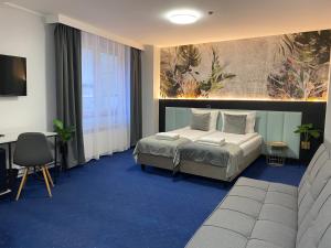 Posteľ alebo postele v izbe v ubytovaní Garbarska 22 Aparthotel