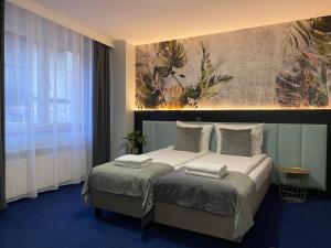 Posteľ alebo postele v izbe v ubytovaní Garbarska 22 Aparthotel