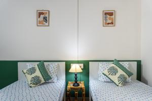 Postel nebo postele na pokoji v ubytování Mulaqat Homestay