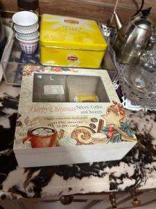 a box of christmas cookies on a table at Luxury Apartment City stars in Cairo