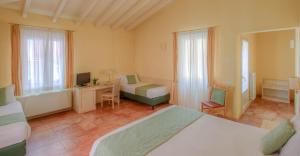 Postel nebo postele na pokoji v ubytování Hotel Belvedere San Gottardo by LVG Hotel Collection + 37 fotografií