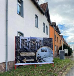 a large painting on the side of a building at Ferienwohnung Flaming House Bitterfeld in Bitterfeld