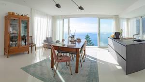 a kitchen and dining room with a view of the ocean at Casa Salvi Positano in Positano