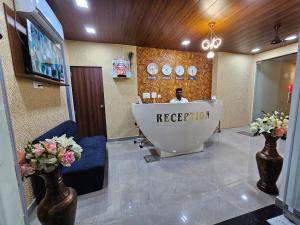 a reception room with a tub in the middle of a room at WELCOME VISTA in Navi Mumbai