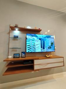 TV a/nebo společenská místnost v ubytování Paraíso de Férias - Flats Copacabana