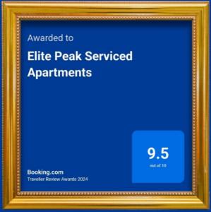 a gold picture frame with a blue background at Elite Peak Serviced Apartments in Bangalore