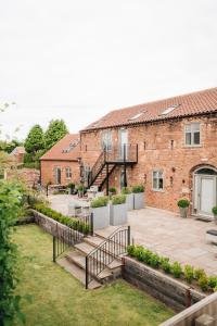 a view of the courtyard of a brick building with stairs at The Old Granary in Barnetby le Wold +88 photos