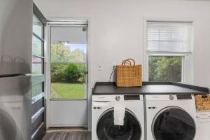 a laundry room with a washer and dryer at Discover Decatur in Decatur