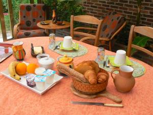a table with a plate of food on it at Le Grenier d'Emma in Potte