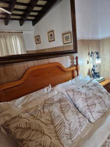 Postel nebo postele na pokoji v ubytování Casa Museo Jerez Centro