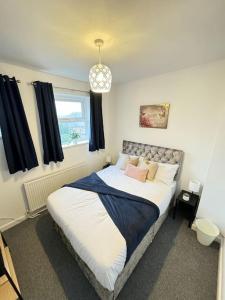a bedroom with a bed and a window at Cosy home in Barnsley centre in Barnsley